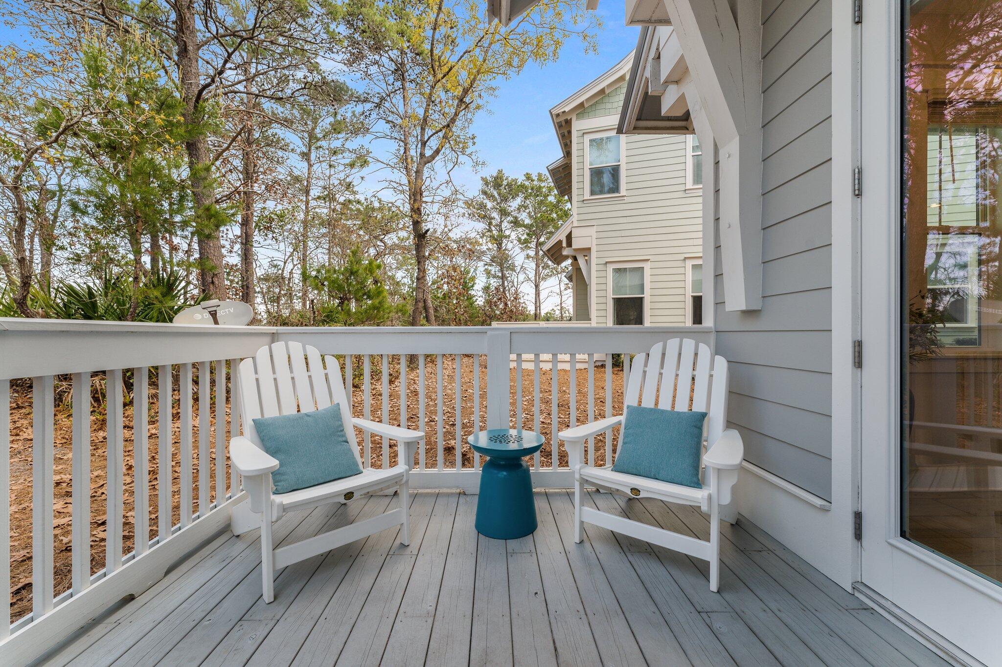 117 Pine Lands Loop Inlet Beach, FL 32461 - Photo 30 of 48 a view of roof deck with chairs and wooden floor