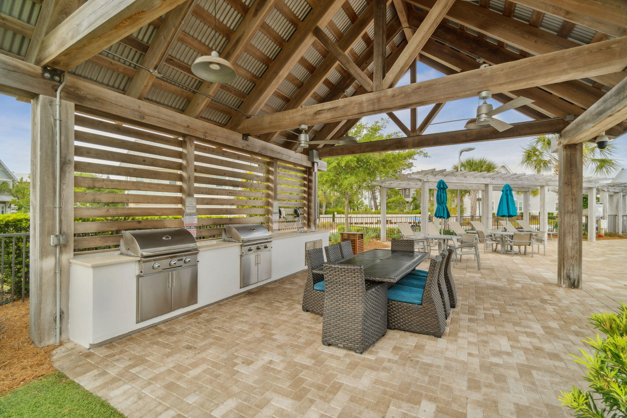 117 Pine Lands Loop Inlet Beach, FL 32461 - Photo 38 of 48 a dining room with patio furniture and kitchen view