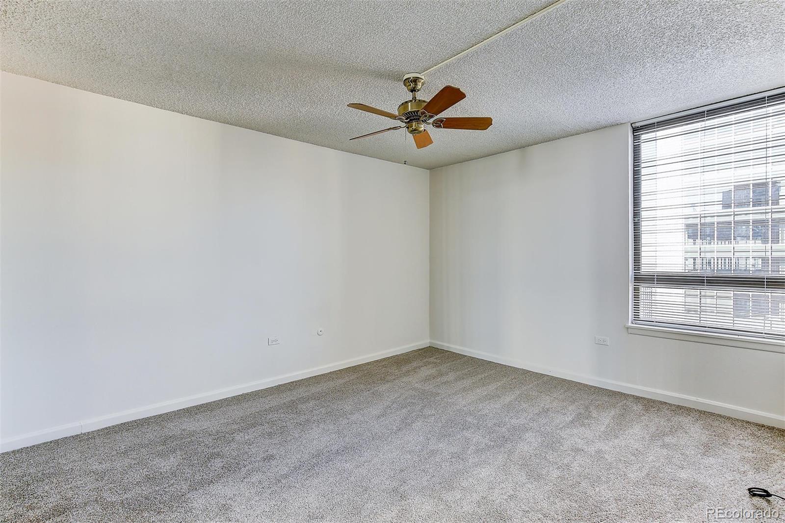 1020 15th Street, Unit 37E Denver, CO 80202 - Photo 14 of 48 an empty room with windows and fan