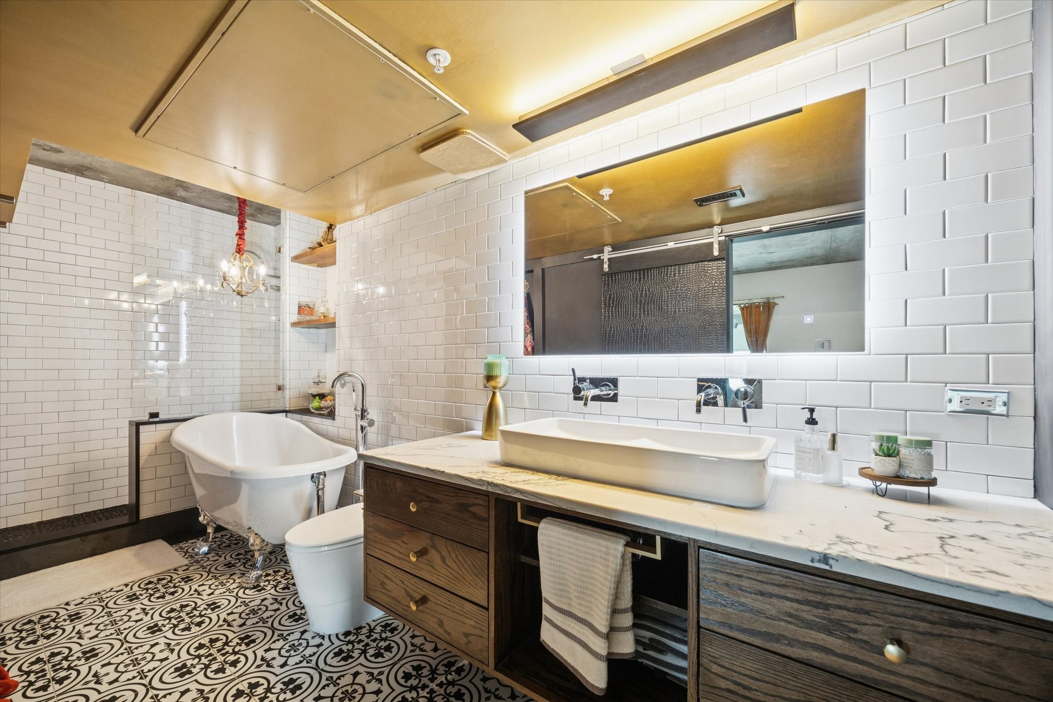 2000 Bagby Street, Unit 5400 Houston, TX 77002 - Photo 24 of 47 Beautifully designed primary bathroom featuring elegant Italian-style floor tiles, creating a refined, spa-like atmosphere with timeless appeal.