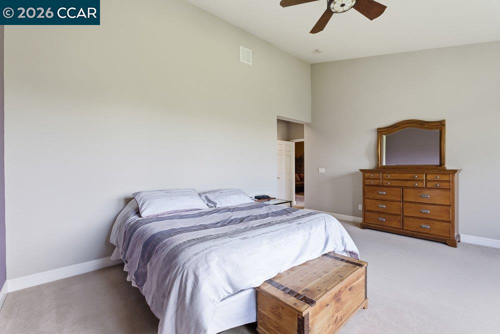 1009 Rolling Woods Way Concord, CA 94521 - Photo 27 of 69 a bedroom with a bed and dresser
