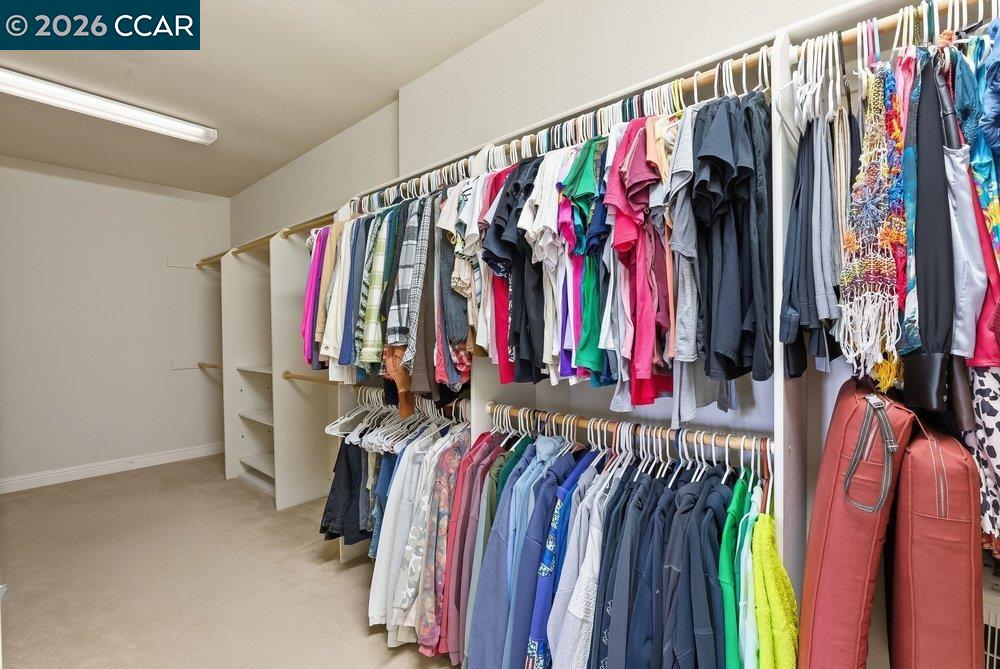 1009 Rolling Woods Way Concord, CA 94521 - Photo 31 of 69 a view of walk in closet with clothes