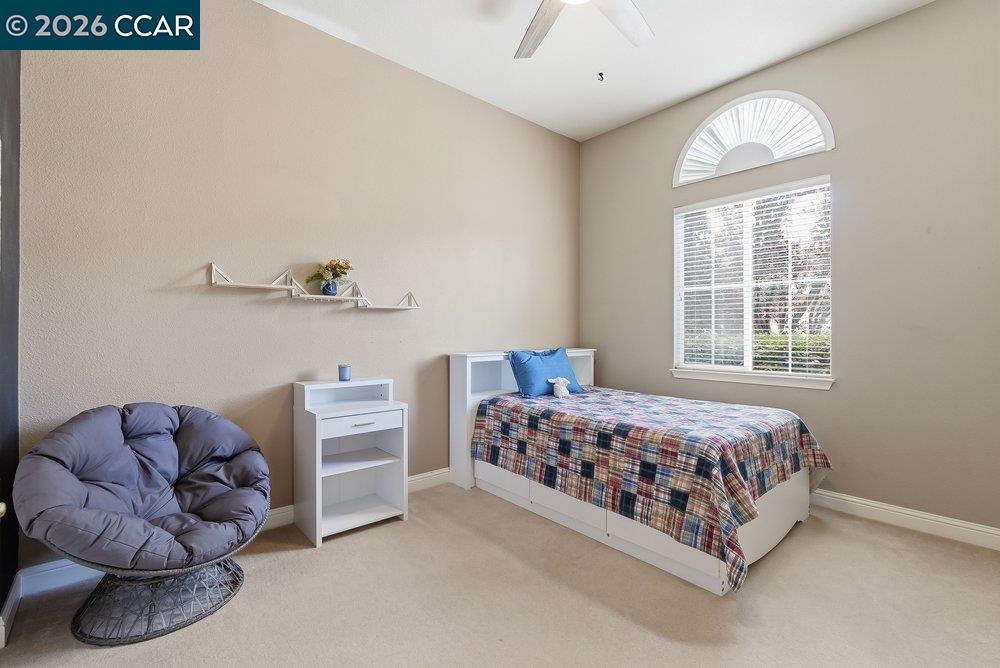 1009 Rolling Woods Way Concord, CA 94521 - Photo 32 of 69 a bedroom with a bed and a couch