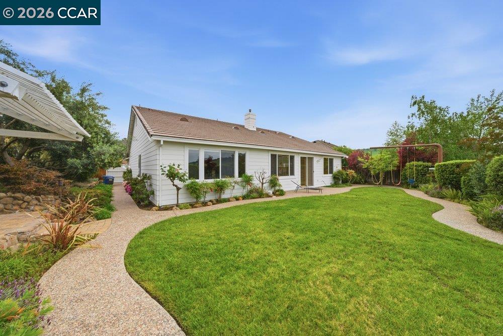 1009 Rolling Woods Way Concord, CA 94521 - Photo 47 of 69 a front view of a house with garden