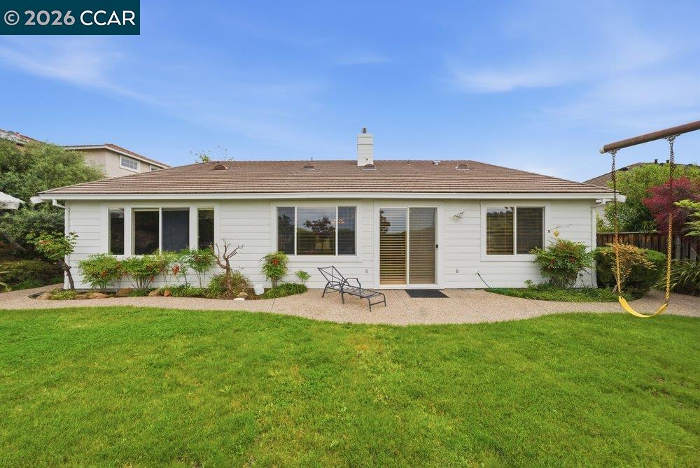 1009 Rolling Woods Way Concord, CA 94521 - Photo 48 of 69 a front view of a house with a yard and patio
