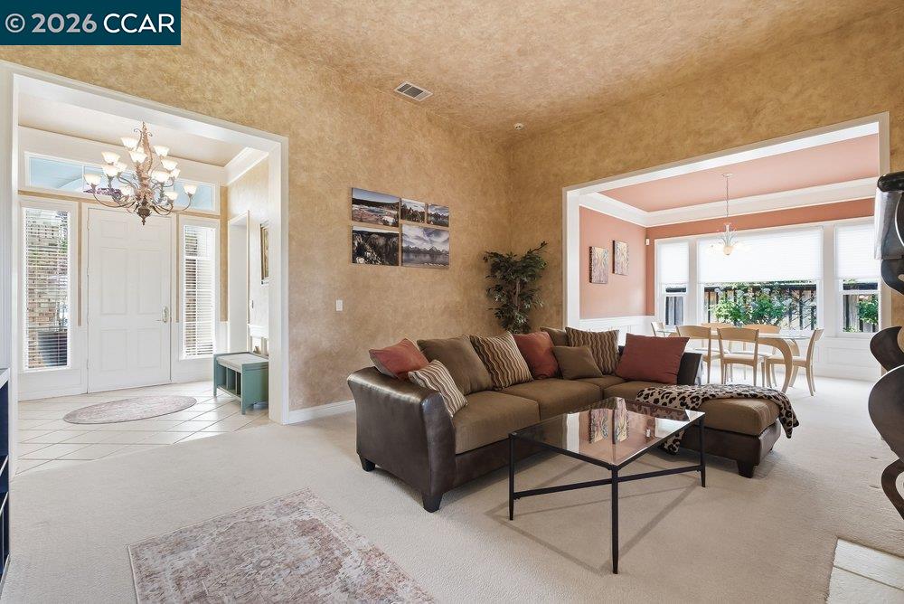 1009 Rolling Woods Way Concord, CA 94521 - Photo 10 of 69 a living room with furniture and a large window