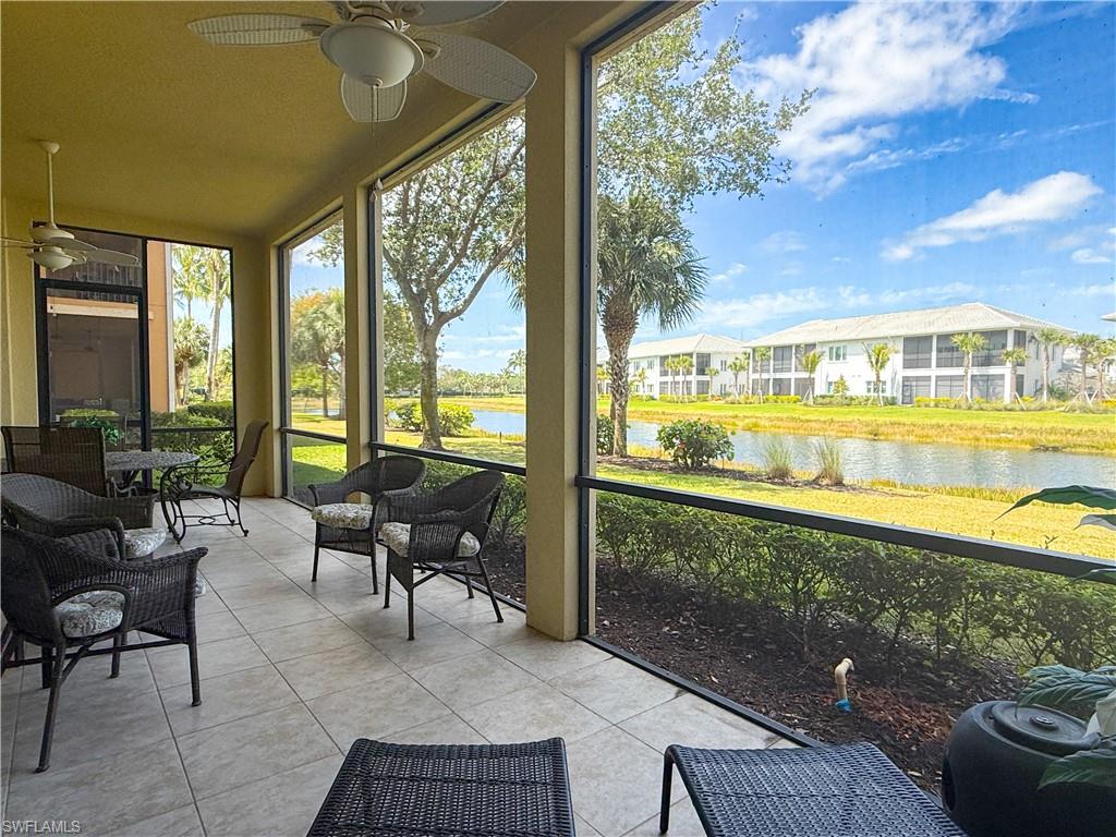 a balcony with furniture and a view of lake