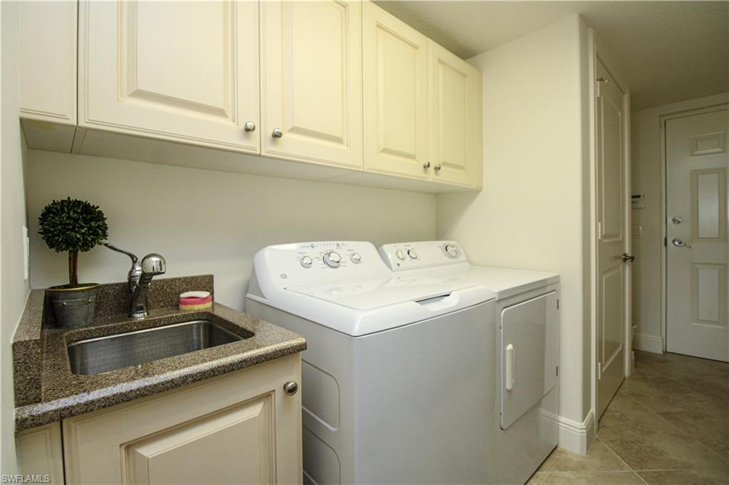 2713 Callista Court, Unit 103 Naples, FL 34114 - Photo 41 of 47 a utility room with dryer and washer