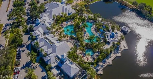 an aerial view of a house with a yard and garden
