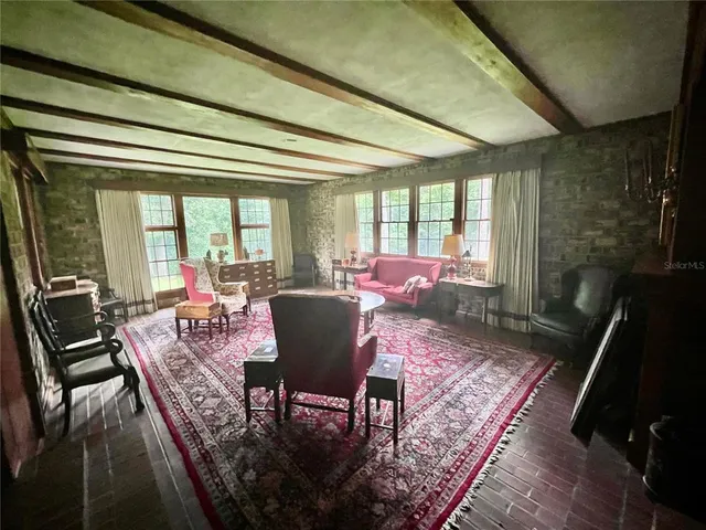 a view of a dining room with furniture window and outside view