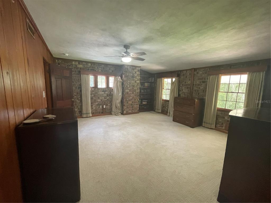 1801 Northwest 30th Terrace Gainesville, FL 32605 - Photo 24 of 36 wooden floor in an empty room with a window