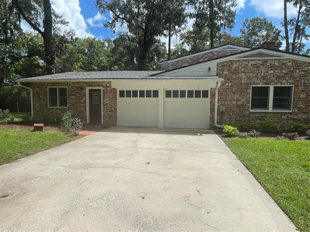 1801 Northwest 30th Terrace Gainesville, FL 32605 - Photo 3 of 36 front view of a house with a yard