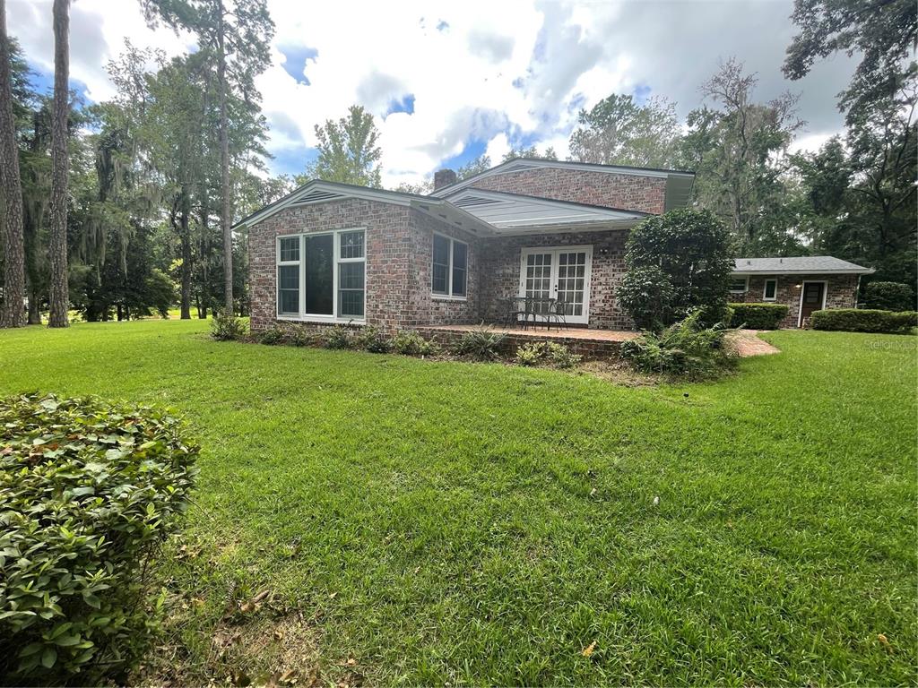 1801 Northwest 30th Terrace Gainesville, FL 32605 - Photo 31 of 36 a front view of house with yard and green space