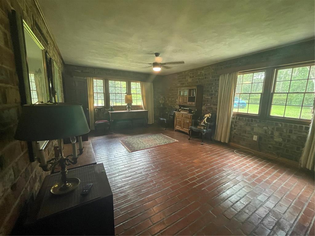 1801 Northwest 30th Terrace Gainesville, FL 32605 - Photo 5 of 36 a living room with furniture and a fireplace