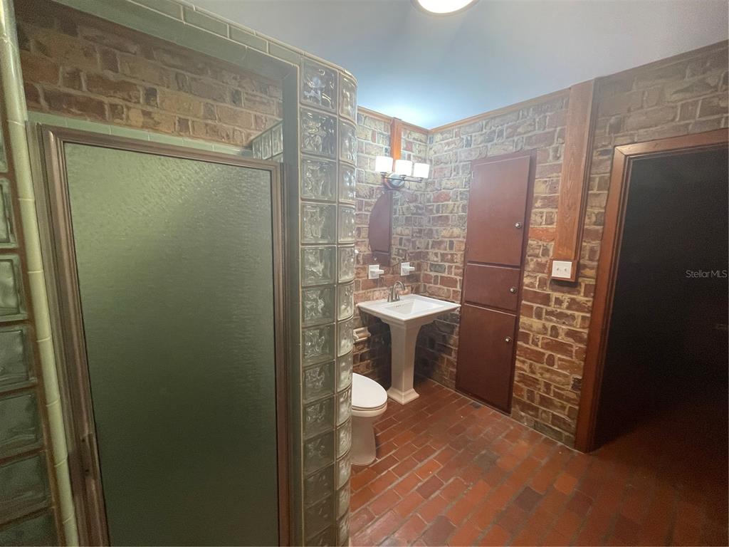 1801 Northwest 30th Terrace Gainesville, FL 32605 - Photo 7 of 36 a bathroom with a shower and a toilet