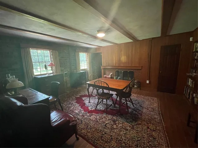 a living room with furniture rug and window