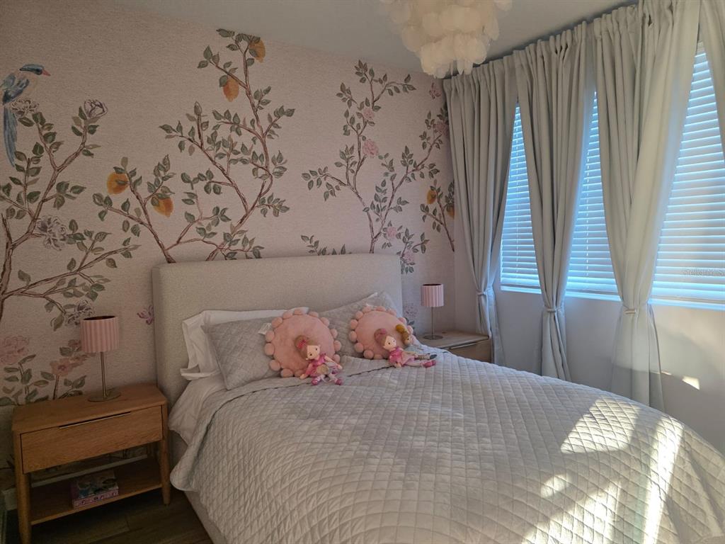 Undisclosed Address Reunion, FL 34747 - Photo 2 of 14 a bedroom with a bed and a window