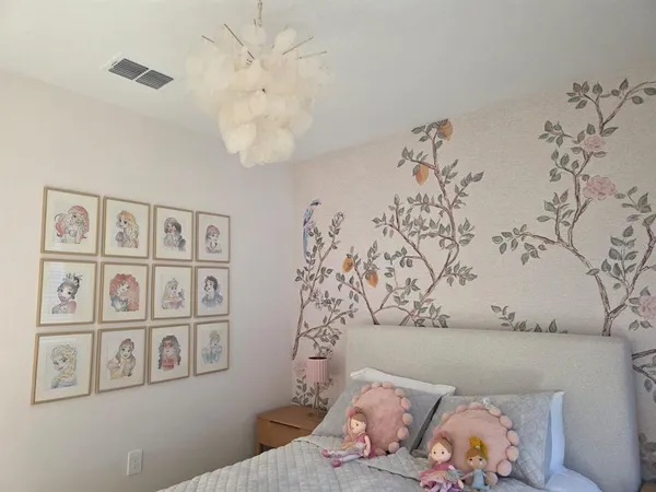 a bedroom with a large bed and a couch