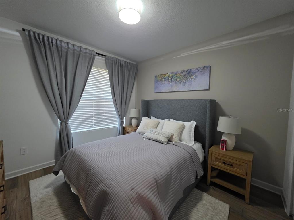 Undisclosed Address Reunion, FL 34747 - Photo 7 of 14 a bedroom with a bed and a window