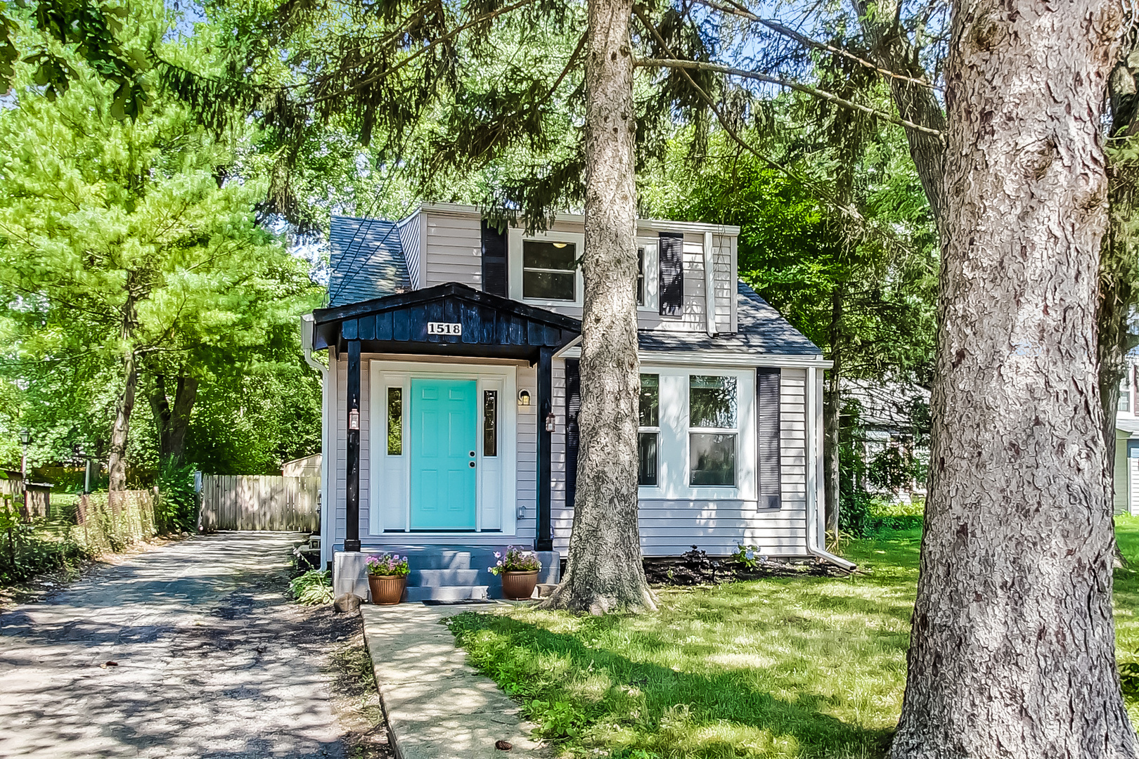 1518 Riverside Avenue St. Charles, IL 60174 - Photo 1 of 40 front view of a house with a garden