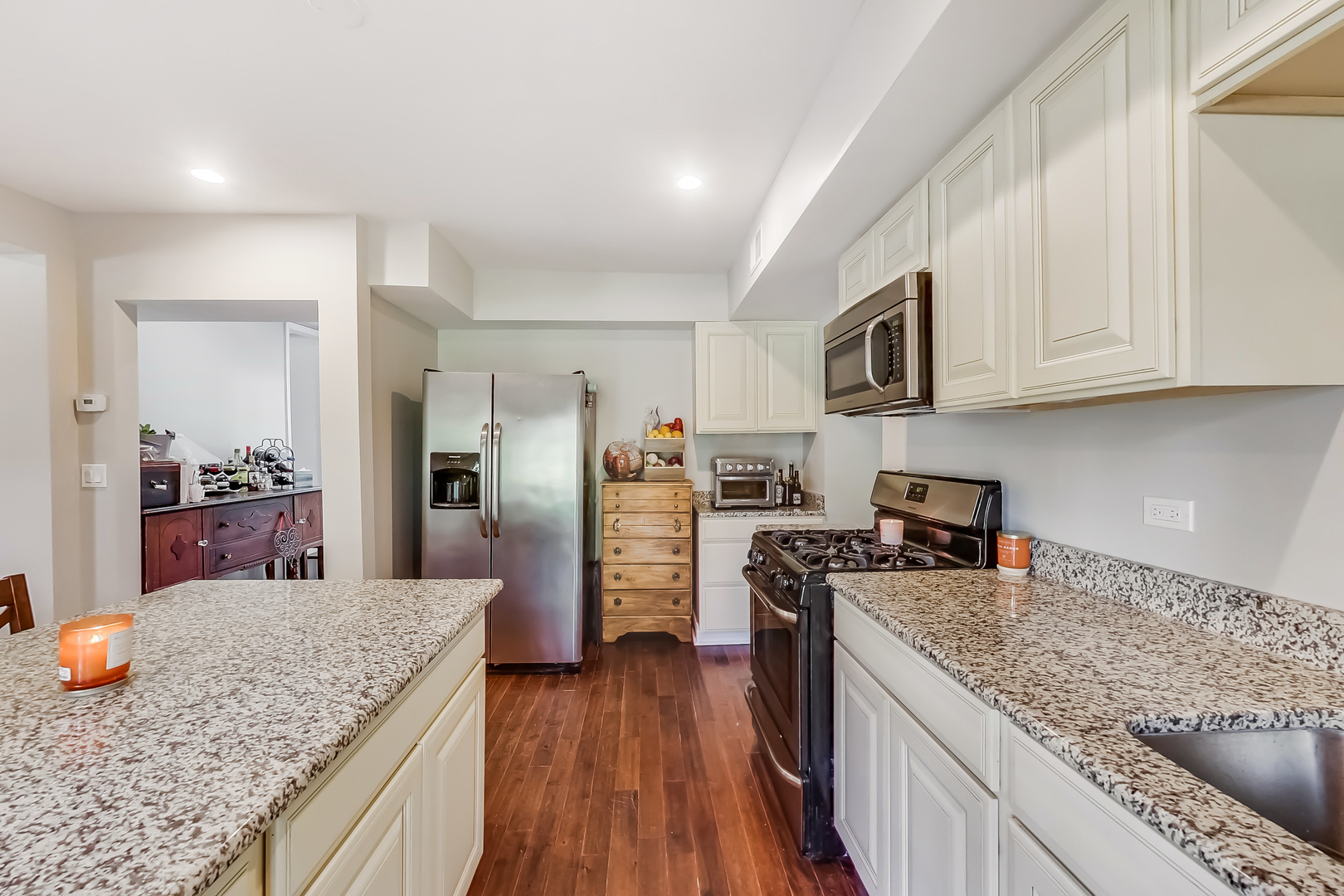 1518 Riverside Avenue St. Charles, IL 60174 - Photo 11 of 40 a kitchen with stainless steel appliances granite countertop a refrigerator stove microwave and sink