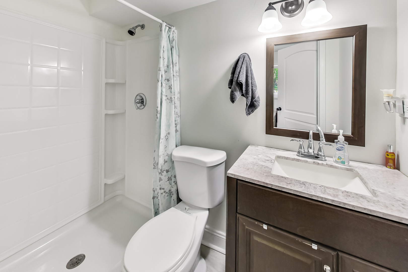 1518 Riverside Avenue St. Charles, IL 60174 - Photo 17 of 40 a bathroom with a granite countertop toilet sink and mirror
