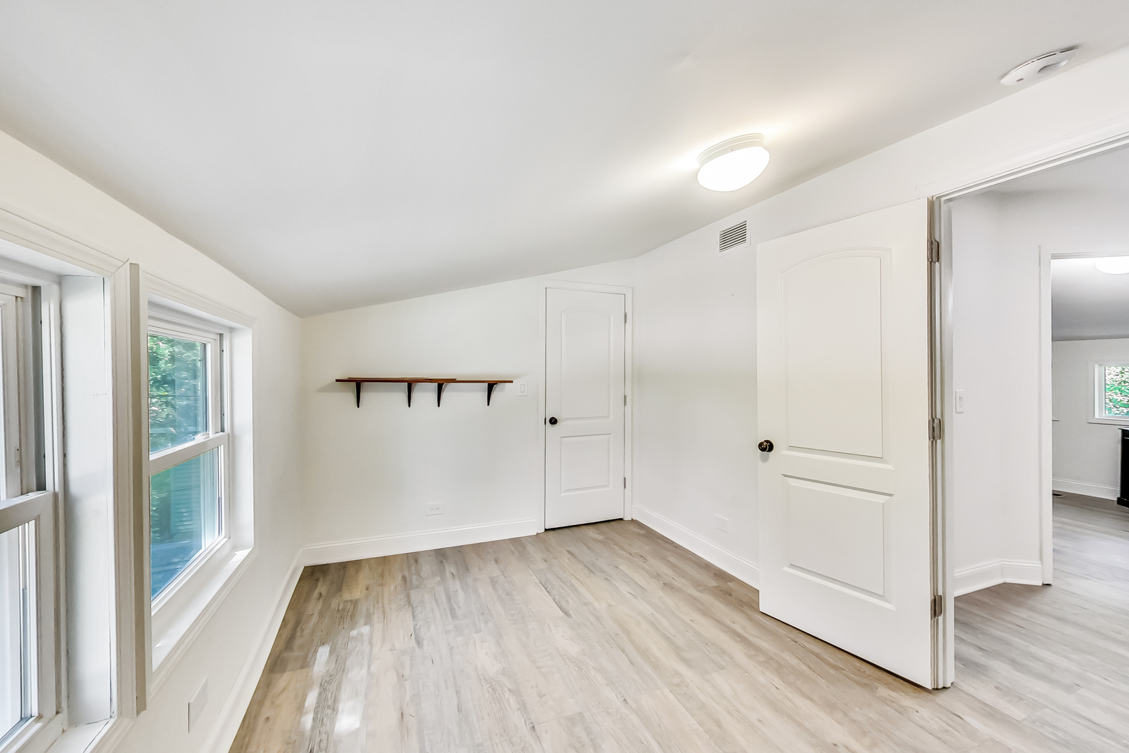 1518 Riverside Avenue St. Charles, IL 60174 - Photo 21 of 40 wooden floor in an empty room with a window