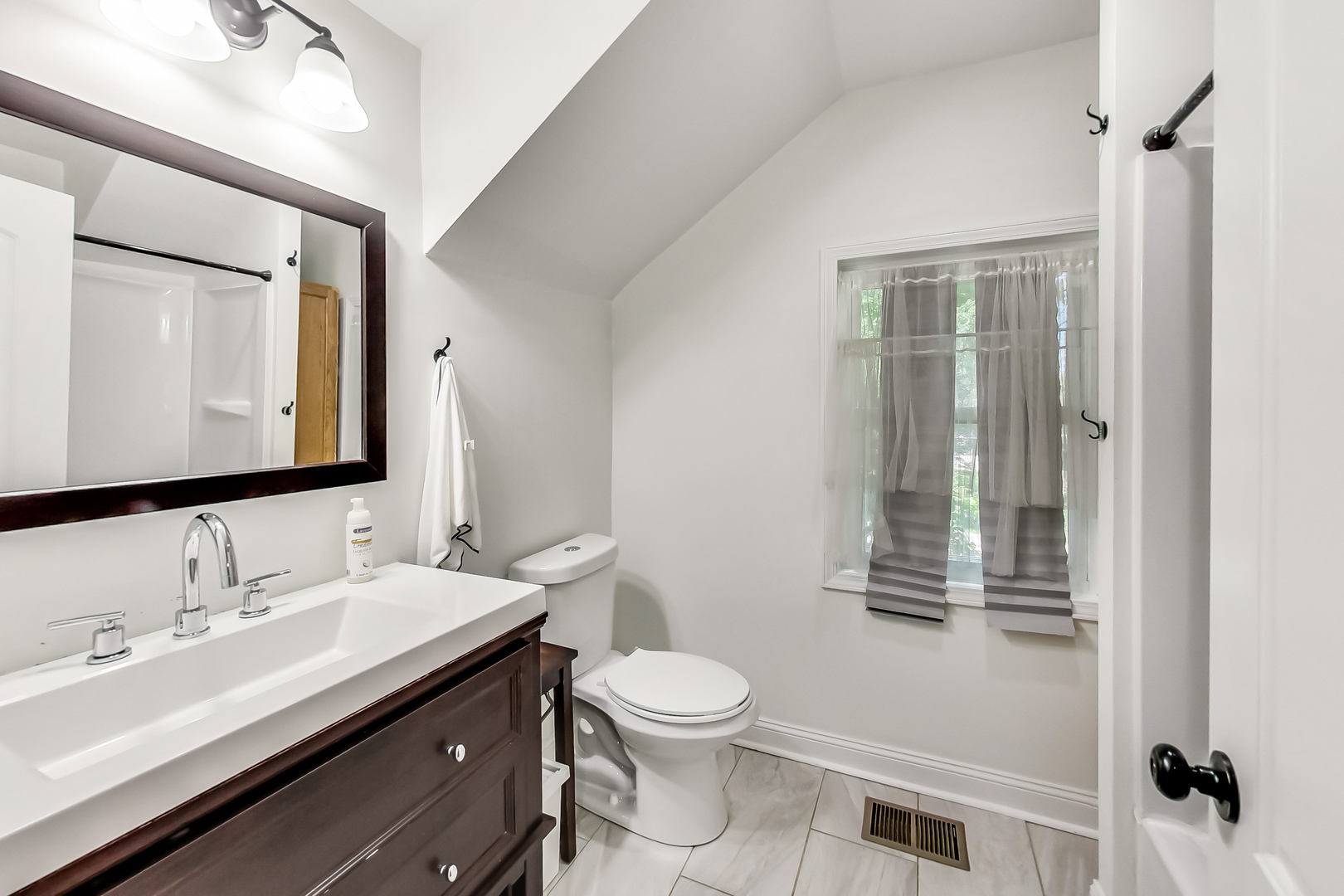 1518 Riverside Avenue St. Charles, IL 60174 - Photo 26 of 40 a bathroom with a toilet a sink and mirror
