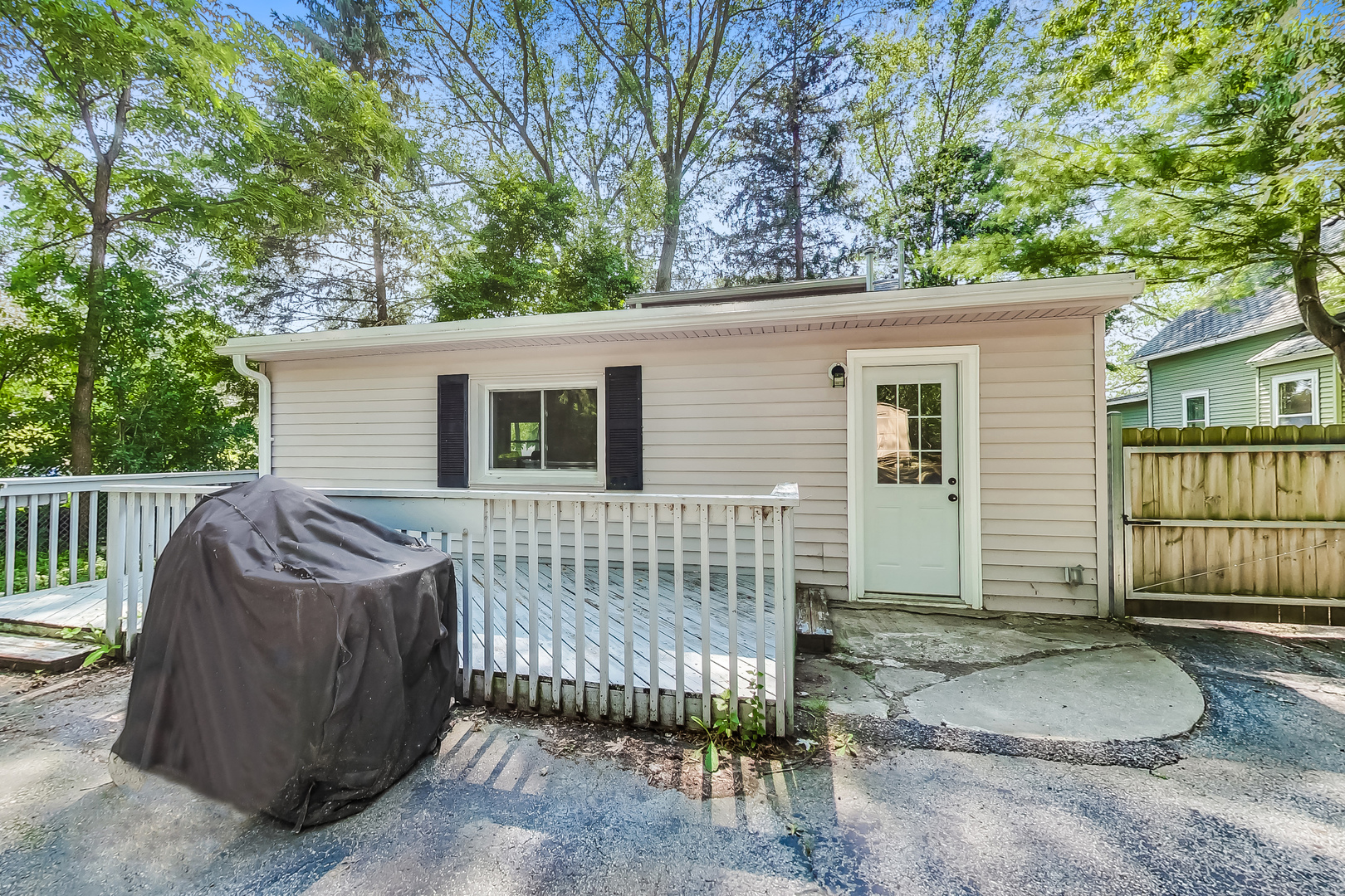 1518 Riverside Avenue St. Charles, IL 60174 - Photo 33 of 40 a view of a house with a balcony and wooden fence