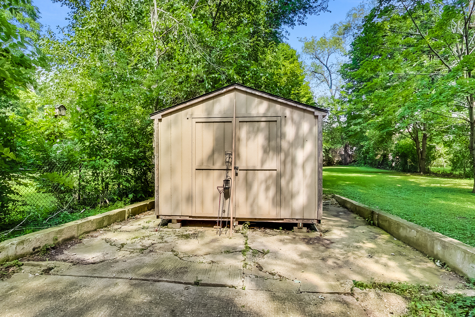 1518 Riverside Avenue St. Charles, IL 60174 - Photo 39 of 40 a view of a small barn in the middle of a yard