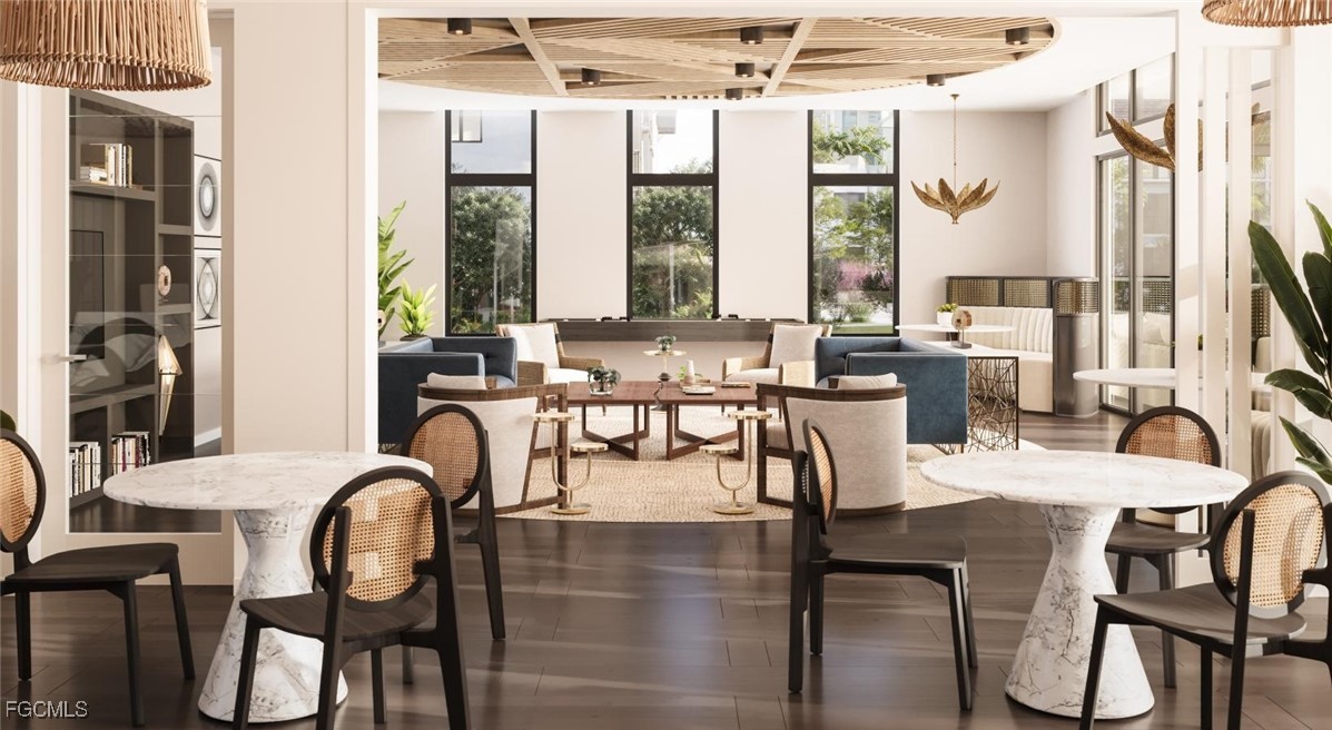 7301 Lake Bank Loop, Unit AMITY Fort Myers, FL 33966 - Photo 12 of 27 a dining room with furniture and large windows