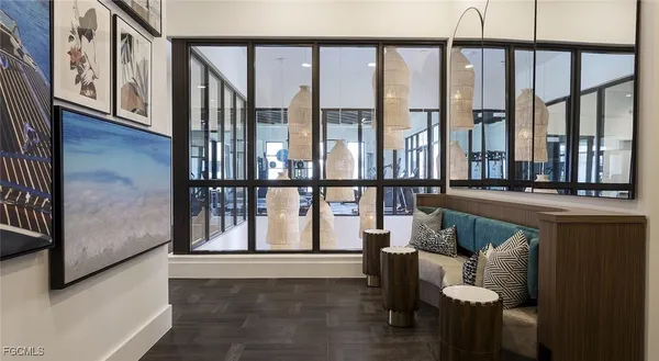 a view of entryway and hall with wooden floor