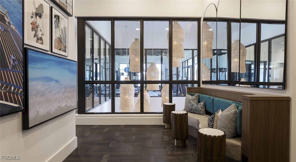 7301 Lake Bank Loop, Unit AMITY Fort Myers, FL 33966 - Photo 9 of 27 a view of entryway and hall with wooden floor