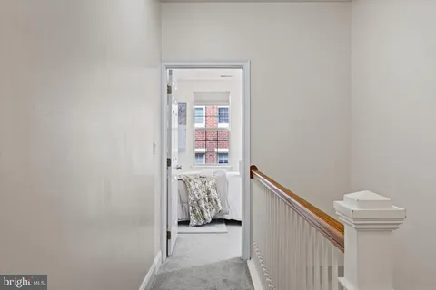 a view of hallway with bathroom