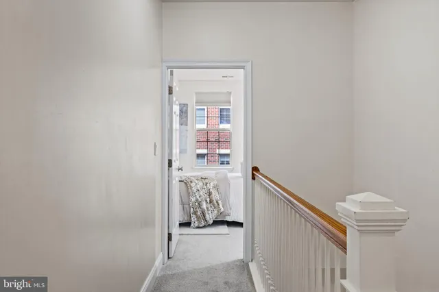 a view of hallway with bathroom