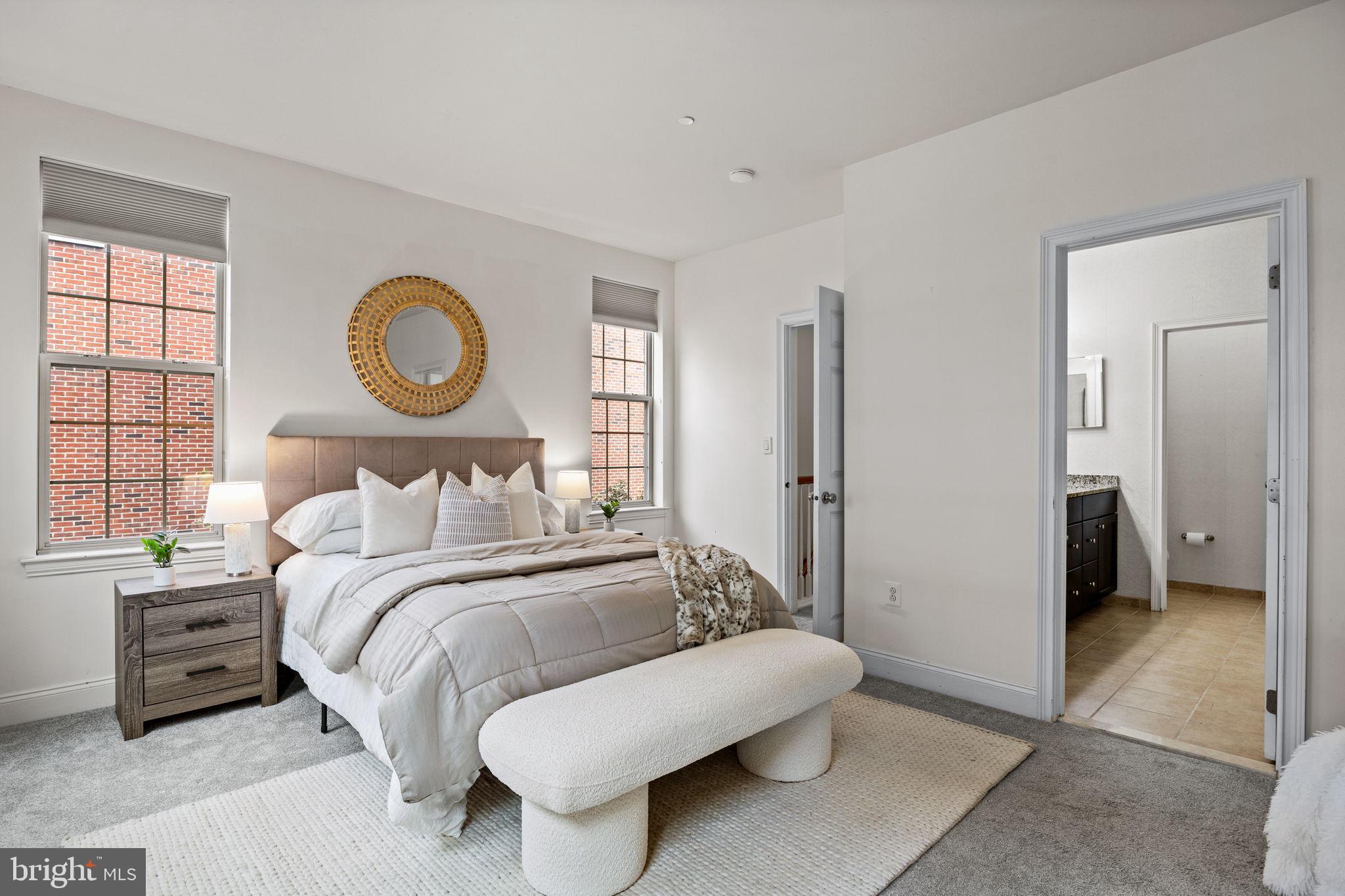 201 Commodore Court Philadelphia, PA 19146 - Photo 21 of 61 a bedroom with a bed a mirror and a window