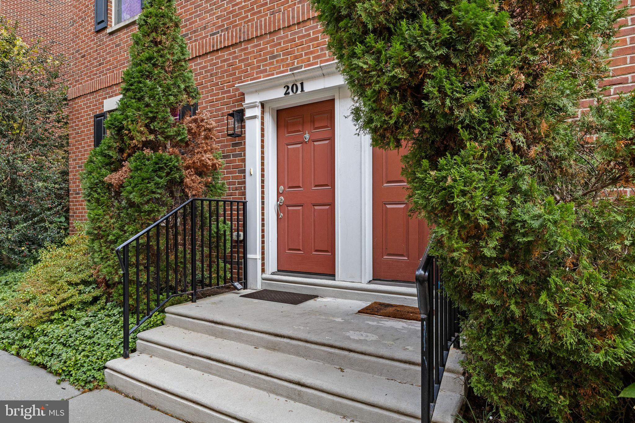 201 Commodore Court Philadelphia, PA 19146 - Photo 44 of 61 a front view of a house with a garden