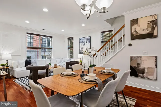 a view of a dining room with furniture window and wooden floor