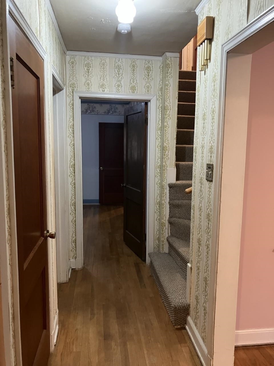 3706 Rhea Avenue Memphis, TN 38122 - Photo 11 of 21 a view of hallway with wooden floor and staircase