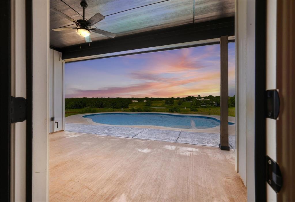 120 Grace Vw Road Weatherford, TX 76088 - Photo 10 of 40 Covered outdoor living area with a ceiling fan, concrete patio, inground pool, and surrounding landscape