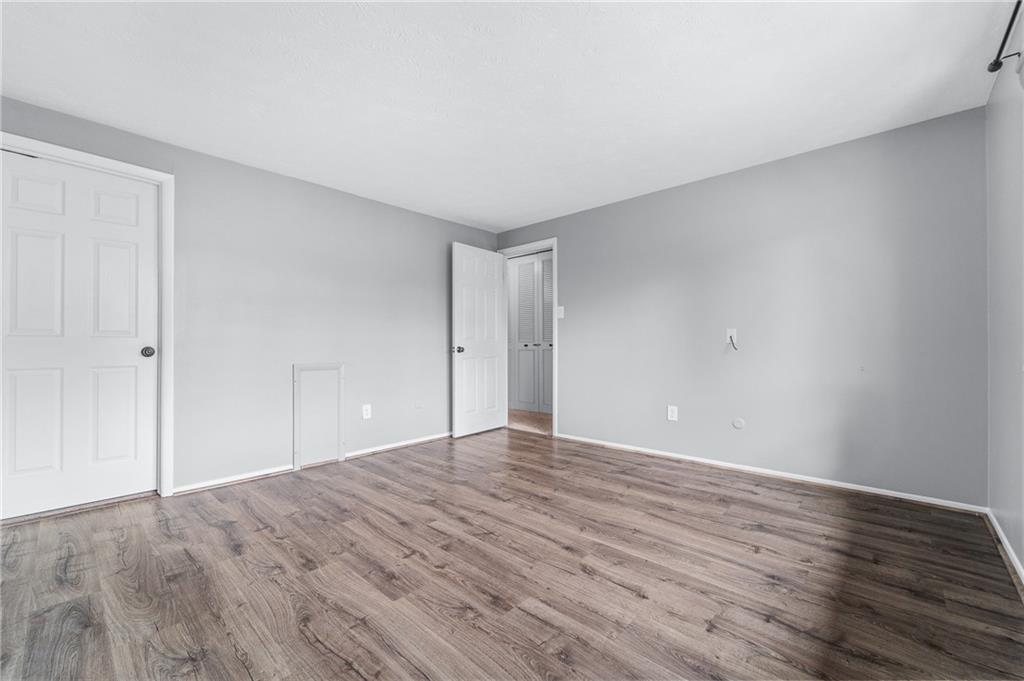 310 Ridge Point Circle Bridgeville, PA 15017 - Photo 11 of 20 a view of an empty room with wooden floor