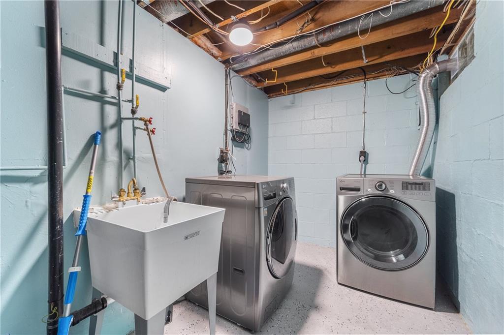 310 Ridge Point Circle Bridgeville, PA 15017 - Photo 16 of 20 a utility room with dryer and washer