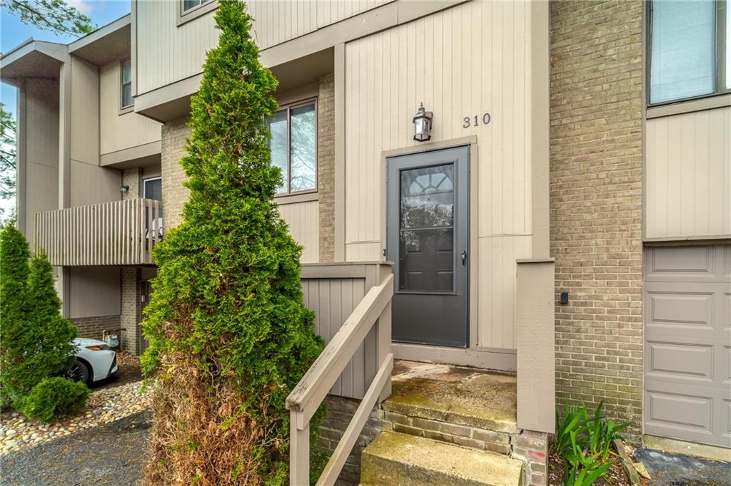 310 Ridge Point Circle Bridgeville, PA 15017 - Photo 2 of 20 front view of a house with a yard