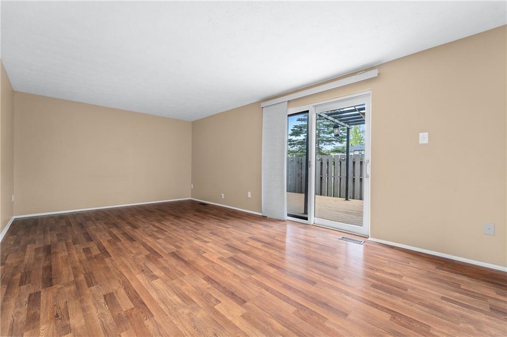 310 Ridge Point Circle Bridgeville, PA 15017 - Photo 7 of 20 a view of an empty room with wooden floor and a window
