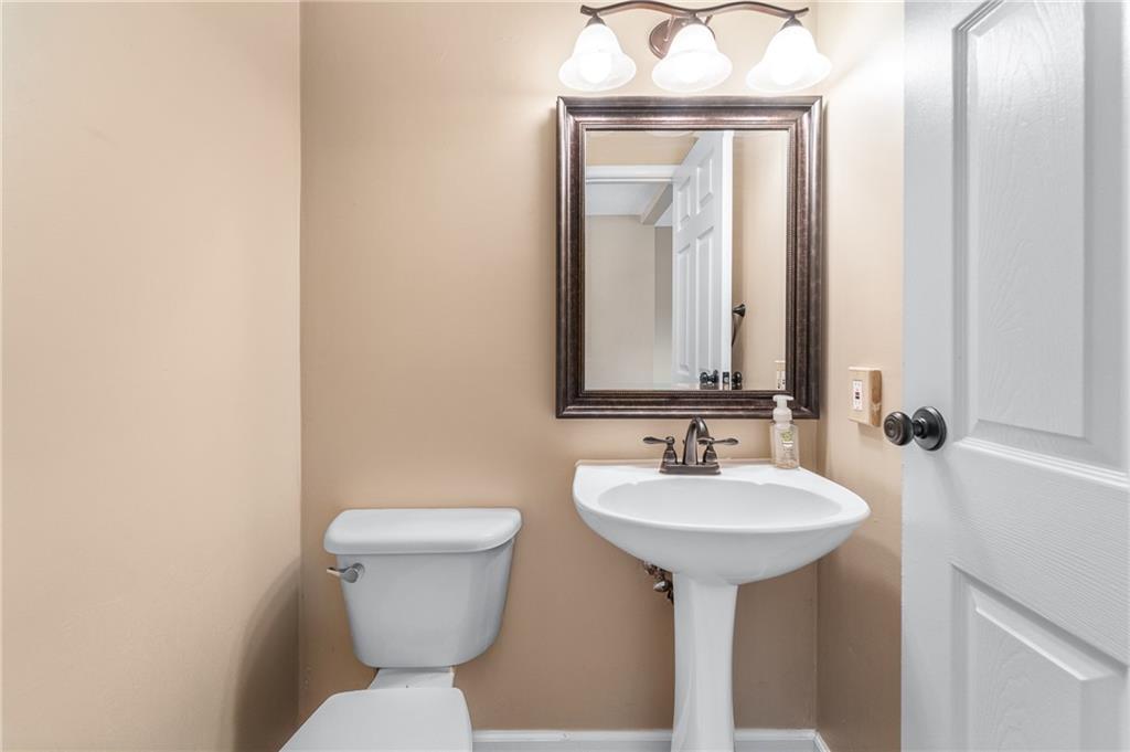 310 Ridge Point Circle Bridgeville, PA 15017 - Photo 10 of 20 a bathroom with a sink and a toilet