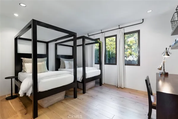 a bedroom with furniture and a window