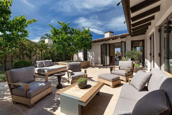 a patio with patio a couch and chairs