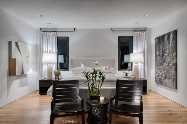 a dining room with furniture and wooden floor