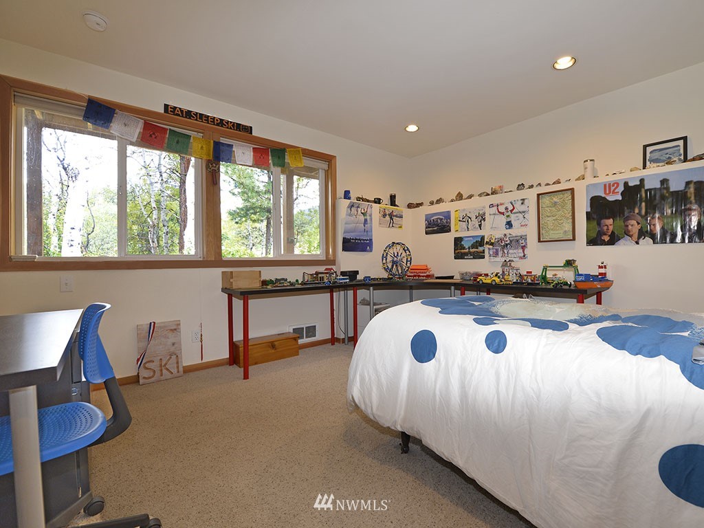 71 Homestead Road Winthrop, WA 98862 - Photo 22 of 25 a bed room with furniture and a large window