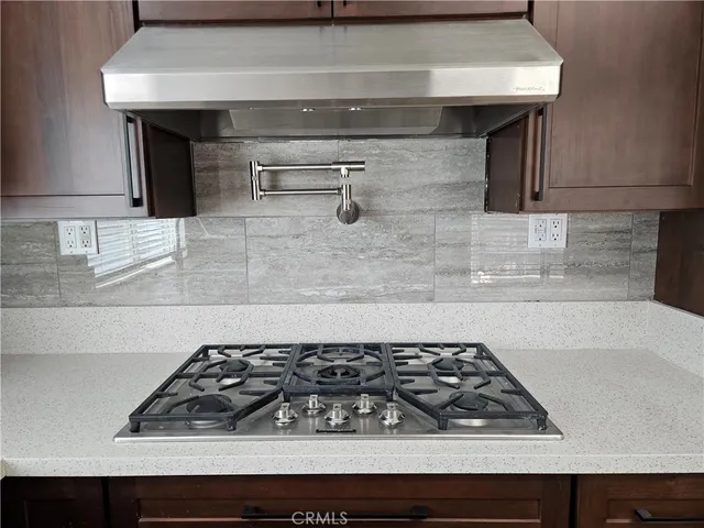 a close view of a stove a microwave and a counter in a kitchen